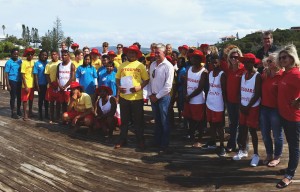 Lifeguards and Wessa beach stewards with Bitou, Cemair and Plett Tourism representatives at the kit handing-over ceremony on Central Beach in Plett.