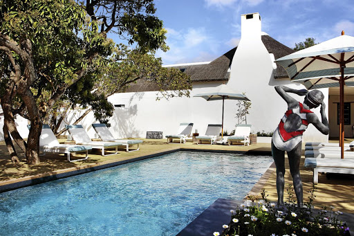 The pool and deck at The Old Rectory have been built around the centuries-old milkwood trees.  Image: Rare Earth