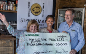 Brenda Wall and Mike Scholtz (Masizame) on either side of and Melanie Burke (Chairman, StreetSmart SA)