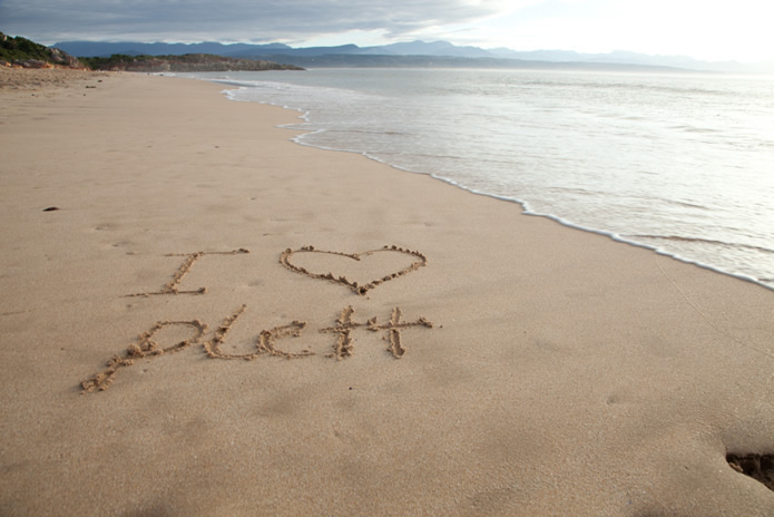 I love Plett written in the sand