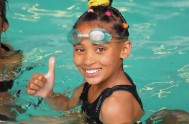 A child gives the thumbs up at the Adopt a Swimmer Breath Holding course led by John McCarthy, and sponsored by Sasfin