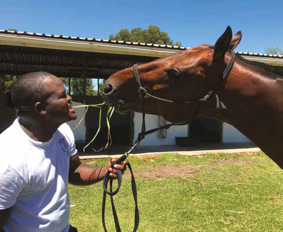 Groom Chris Taombe horsing around at Kurland stables