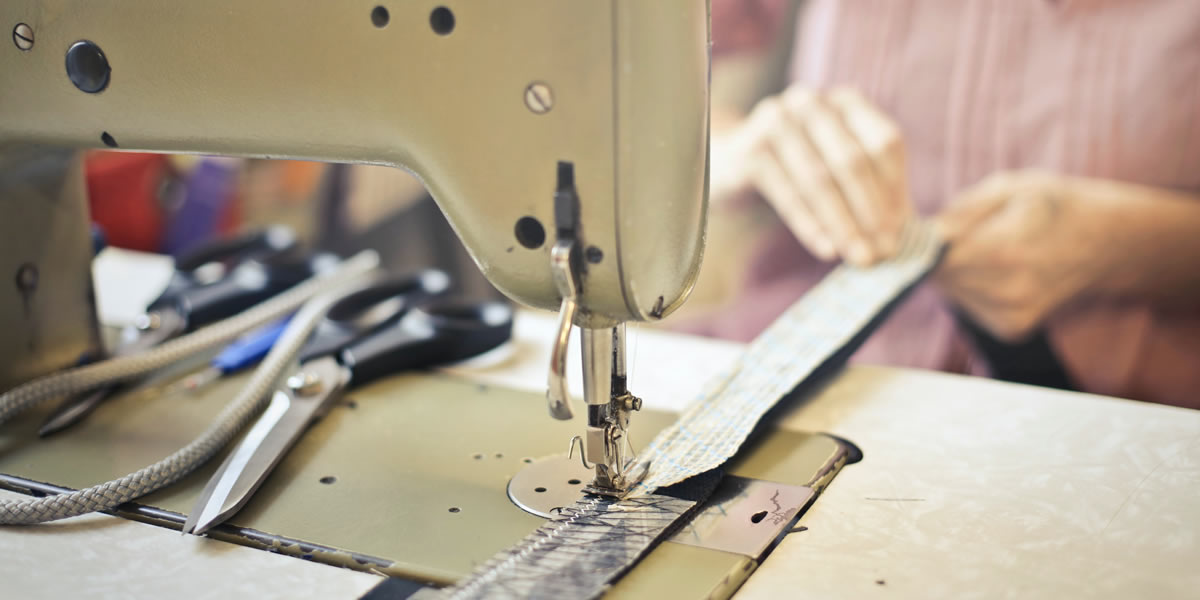 seamstress-stitching-clothing